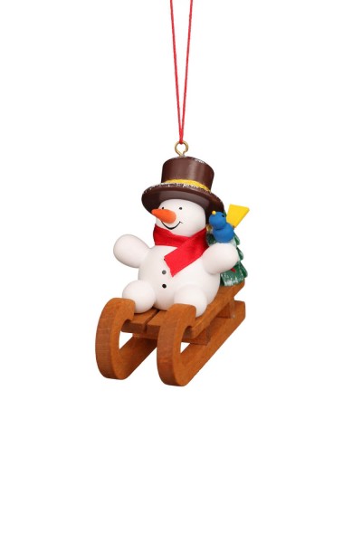Christmas tree decoration snowman on sled, colorful by Christian Ulbricht