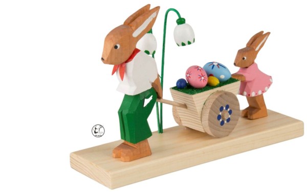 Easter bunny man with child and cart, carved by Bettina Franke